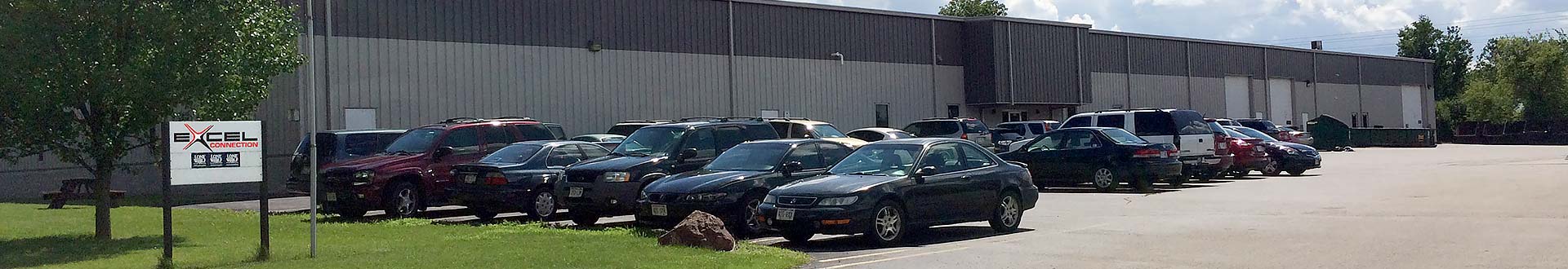 Exterior view of Excel Connection headquarters and parking lot in Milwaukee, Wisconsin